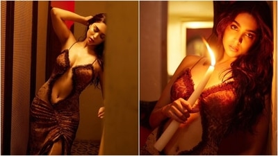 The brown-coloured ensemble features an animal pattern, spaghetti straps, a plunging neckline, a cut-out on the front exposing her midriff, ruffled brown lace adorned on the trims, a figure-hugging silhouette, gathered design on the waist, midi hem length, and a thigh-high slit on the front. She styled the look with centre-parted open wavy locks, darkened brows, smoky eye shadow, mascara on the lashes, rouge on the cheekbones, highlighter on the contours, and glossy pink lips. (Instagram) The brown-coloured ensemble features an animal pattern, spaghetti straps, a plunging neckline, a cut-out on the front exposing her midriff, ruffled brown lace adorned on the trims, a figure-hugging silhouette, gathered design on the waist, midi hem length, and a thigh-high slit on the front. She styled the look with centre-parted open wavy locks, darkened brows, smoky eye shadow, mascara on the lashes, rouge on the cheekbones, highlighter on the contours, and glossy pink lips. (Instagram)