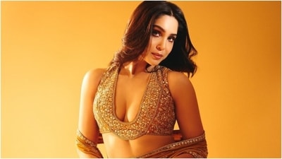 The saree is decked in silver sequin and taar embroidered borders and embellishments done in a floral pattern. The pre-draped number features a mermaid silhouette, a floor-length hem, and the pallu draped on her arms like a dupatta. Meanwhile, the sleeveless blouse has a plunging neckline and a cropped silhouette. (Instagram) The saree is decked in silver sequin and taar embroidered borders and embellishments done in a floral pattern. The pre-draped number features a mermaid silhouette, a floor-length hem, and the pallu draped on her arms like a dupatta. Meanwhile, the sleeveless blouse has a plunging neckline and a cropped silhouette. (Instagram)