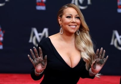 Singer Mariah Carey shows her hands after placing them in cement in the forecourt of the TCL Chinese theatre in Los Angeles. (REUTERS) Singer Mariah Carey shows her hands after placing them in cement in the forecourt of the TCL Chinese theatre in Los Angeles. (REUTERS)