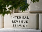 FILE - A sign outside the Internal Revenue Service building is seen, May 4, 2021, in Washington. As tax filing season officially starts Monday, Jan. 29, 2024, a limited number of taxpayers in 12 states will soon be eligible for a program that will allow them to calculate and submit their returns directly to the IRS without having to pay for commercial tax preparation software. The Direct File pilot program is set to be rolled out in phases. (AP Photo/Patrick Semansky, File)