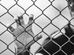 The man climbed down the prison wall using knotted bed sheets. The man climbed down the prison wall using knotted bed sheets.