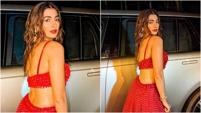 Meanwhile, for the glam picks, Pooja chose shimmery eye shadow, mascara on the lashes, feathered brows, bold red lip shade, highlighter on the contours, rouge on the cheekbones, and kohl-lined eyes. Lastly, centre-parted open locks styled with beach waves completed the wedding season look. (Instagram) Meanwhile, for the glam picks, Pooja chose shimmery eye shadow, mascara on the lashes, feathered brows, bold red lip shade, highlighter on the contours, rouge on the cheekbones, and kohl-lined eyes. Lastly, centre-parted open locks styled with beach waves completed the wedding season look. (Instagram)