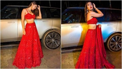 Coming to the design elements, the bralette blouse Pooja wore features spaghetti straps, a plunging neckline flaunting her decolletage, an asymmetric hem, a fitted bust, and a midriff-exposing cropped hem. Additionally, it comes decked in mirror fringe embellishments that add an ethereal charm to the top. (Instagram) Coming to the design elements, the bralette blouse Pooja wore features spaghetti straps, a plunging neckline flaunting her decolletage, an asymmetric hem, a fitted bust, and a midriff-exposing cropped hem. Additionally, it comes decked in mirror fringe embellishments that add an ethereal charm to the top. (Instagram)