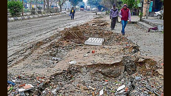 A caved in portion of the Sherpur Road in Ludhiana. (HT)