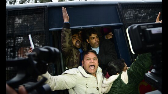 Police taking away AAP leaders who started a relay hunger strike outside the MC office in Chandigarh on Sunday. (Sanjeev Sharma/HT)