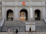 A Beijing court on Monday handed Australian writer Yang Hengjun a suspended death sentence, a family friend said, five years after he was first detained in China and three years after a closed-door trial on espionage charges.
