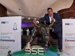 Paytm Crisis: Paytm founder and CEO Vijay Shekhar Sharma poses with a bronze replica of a bull at the Bombay Stock Exchange (BSE) in Mumbai.