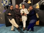 Ustad Zakir Hussain, vocalist Shankar Mahadevan, percussionist V Selvaganesh and violinist Ganesh Rajagopalan of Shakti pose for photos with their Grammy Award for best global music album for This Moment 