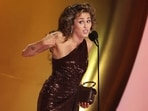 Miley Cyrus accepts the award for Record of the Year for Flowers during the 66th Annual Grammy Awards. 