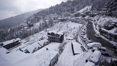 A view of snow covered rooftops and trees after fresh snowfall at Kufri near Shimla on Monday. (Deepak Sansta/HT) A view of snow covered rooftops and trees after fresh snowfall at Kufri near Shimla on Monday. (Deepak Sansta/HT)