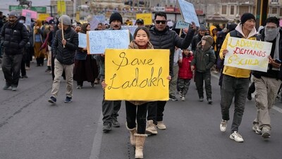People holding placards take part in the '"Leh Chalo Andolan" called by Kargil Democratic Alliance (KDA) and Leh Apex Body (LAB) demanding the implementation of the 6th Schedule, Statehood, Land, and job security and separate Lok Sabha Seat in Parliament for Kargil and Leh, in Leh. (ANI) People holding placards take part in the '"Leh Chalo Andolan" called by Kargil Democratic Alliance (KDA) and Leh Apex Body (LAB) demanding the implementation of the 6th Schedule, Statehood, Land, and job security and separate Lok Sabha Seat in Parliament for Kargil and Leh, in Leh. (ANI)