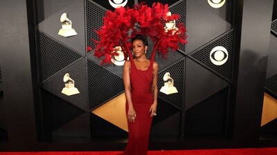 Dawn Richard, wearing a scarlet gown with floral-patterned sleeves, was a living example of art on the Grammy red carpet. Elegant in her Khosrov couture gown, Richard exuded beauty. The bodice was adorned with an array of crimson floral embellishments, reminiscent of a flowering tree. The outfit is from the Khosrov line, which was inspired by Sandro Botticelli's famous 'Primavera' painting. (REUTERS)