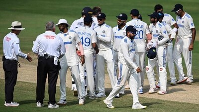 India's players shake hands with each other after winning the second Test cricket match between India and England at the Y.S. Rajasekhara Reddy Cricket Stadium in Visakhapatnam (AFP)