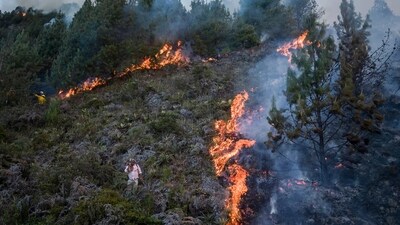 A wildfire burns on the slopes of the mountains. (AP) A wildfire burns on the slopes of the mountains. (AP)