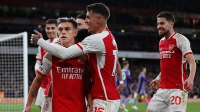 Leandro Trossard (C) celebrates with teammates after scoring his team third goal during the Premier League match between Arsenal and Liverpool at the Emirates Stadium in London. (AFP) Leandro Trossard (C) celebrates with teammates after scoring his team third goal during the Premier League match between Arsenal and Liverpool at the Emirates Stadium in London. (AFP)