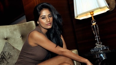 Indian model Poonam Pandey (2011 Kingfisher Calendar girl) poses for a candid photo shoot in Mumbai on June 1, 2012. (AFP)