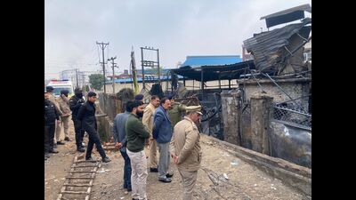 Himachal industries minister Harshwardhan Chauhan inspecting the site of the blaze, in Baddi on Monday. (HT Photo)