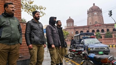 Policemen stand guard along a street ahead of Pakistan's national elections 2024. (AFP/File) Policemen stand guard along a street ahead of Pakistan's national elections 2024. (AFP/File)