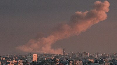 A picture taken from Rafah in the southern Gaza Strip shows smoke rising over buildings in Khan Yunis. (AFP) A picture taken from Rafah in the southern Gaza Strip shows smoke rising over buildings in Khan Yunis. (AFP)