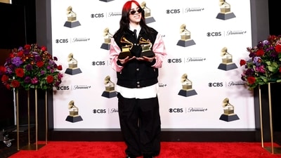 Billie Eilish, winner of the Song of the Year and Best Song Written Visual Media award for What Was I Made For?, poses in the press room during the 66th Grammy Awards. Billie wore a vintage Barbie varsity jacket reworked by Chrome Hearts over an oversized white Willy Chavarria button-up and black skinny tie, plus black pants.&nbsp; (Getty Images via AFP)