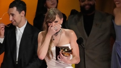 Taylor Swift accepts the award for album of the year for "MIdnights" during the 66th annual Grammy Awards on Sunday, Feb. 4, 2024, in Los Angeles. (AP Photo/Chris Pizzello) (Chris Pizzello/Invision/AP) Taylor Swift accepts the award for album of the year for "MIdnights" during the 66th annual Grammy Awards on Sunday, Feb. 4, 2024, in Los Angeles. (AP Photo/Chris Pizzello) (Chris Pizzello/Invision/AP)