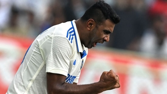 Ravichandran Ashwin celebrates after taking the wicket of England's Ollie Pope (AFP)