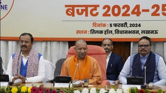 Uttar Pradesh chief minister Yogi Adityanath at a press conference after the presentation of the state budget in Lucknow on Monday. His flanked by deputy chief ministers Keshav Prasad Maurya and Brajesh Pathak. (Deepak Gupta/HT Photo)