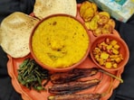 Bhoger Khichuri: This is a traditional Bengali dish prepared during Saraswati Puja as an offering to Goddess Saraswati. It is a savoury rice and lentil dish cooked with vegetables and mild spices, often served with fried vegetables (bhaja) and a mixed vegetable curry (labra).&nbsp;(Instagram/@calcutta_with_photography)