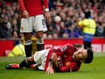 Manchester United's Lisandro Martinez grimaces in pain after an injury during the English Premier League match vs West Ham United