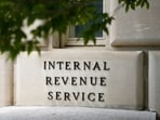 FILE - A sign outside the Internal Revenue Service building is seen, May 4, 2021, in Washington. As tax filing season officially starts Monday, Jan. 29, 2024, a limited number of taxpayers in 12 states will soon be eligible for a program that will allow them to calculate and submit their returns directly to the IRS without having to pay for commercial tax preparation software. The Direct File pilot program is set to be rolled out in phases. (AP Photo/Patrick Semansky, File)