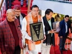 Uttarakhand Chief Minister Pushkar Singh Dhami with others holds a copy of the Constitution of India, at Vidhan Sabha Bhawan, in Dehradun. Uttarakhand Chief Minister Pushkar Singh Dhami with others holds a copy of the Constitution of India, at Vidhan Sabha Bhawan, in Dehradun.