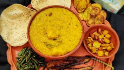 Bhoger Khichuri: This is a traditional Bengali dish prepared during Saraswati Puja as an offering to Goddess Saraswati. It is a savoury rice and lentil dish cooked with vegetables and mild spices, often served with fried vegetables (bhaja) and a mixed vegetable curry (labra).&nbsp; (Instagram/@calcutta_with_photography)