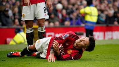 Manchester United's Lisandro Martinez grimaces in pain after an injury during the English Premier League match vs West Ham United (AP) Manchester United's Lisandro Martinez grimaces in pain after an injury during the English Premier League match vs West Ham United (AP)