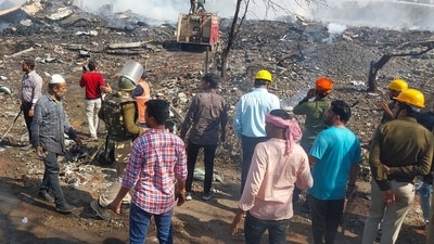 Rescue personnel and local residents gather near the firecracker plant following the explosion at Harda district in Madhya Pradesh. PM Modi has also announced <span class='webrupee'>₹</span>50,000 for the injured. (AFP) Rescue personnel and local residents gather near the firecracker plant following the explosion at Harda district in Madhya Pradesh. PM Modi has also announced <span class='webrupee'>₹</span>50,000 for the injured. (AFP)