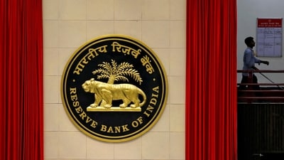 RBI Monetary Policy meeting: A worker walks past the logo of Reserve Bank of India (RBI) inside its office in New Delhi, India. (Reuters)