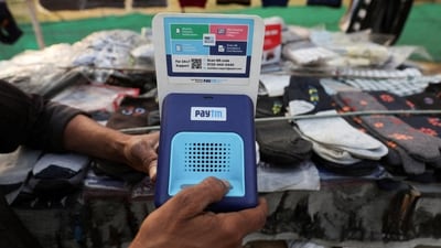 Paytm Crisis: Cutlery vendor switches on Paytm, a digital payments firm, speaker to receive received payment details at a roadside market in Ahmedabad. (Reuters)