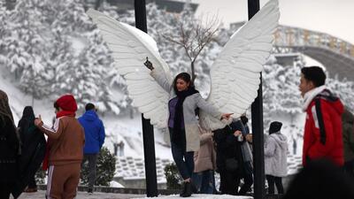People gather at the snow-covered Parvaz parc in Tehran on February 2 (AFP FILE) People gather at the snow-covered Parvaz parc in Tehran on February 2 (AFP FILE)