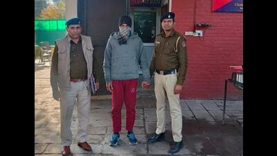 The accused in custody of police in Chandigarh. He used to work as a bike taxi driver at Rapido (HT Photo)