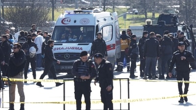 Police forensic experts examine the area after a shooting outside the Caglayan courthouse in Istanbul on February 6. (Reuters)