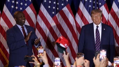 U.S. Sen Tim Scott (R-SC) and Republican presidential candidate and former U.S. President Donald Trump (Getty Images via AFP) U.S. Sen Tim Scott (R-SC) and Republican presidential candidate and former U.S. President Donald Trump (Getty Images via AFP)