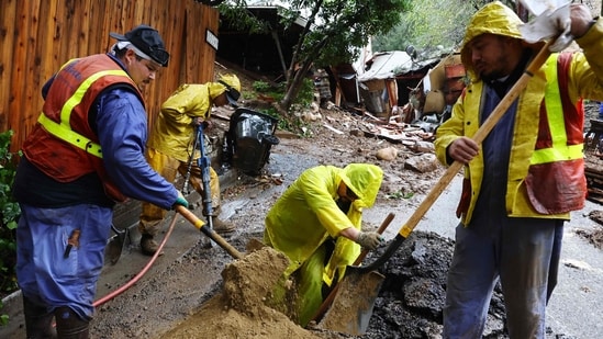 Photos | Hundreds of thousands without power as dangerous storm batters ...