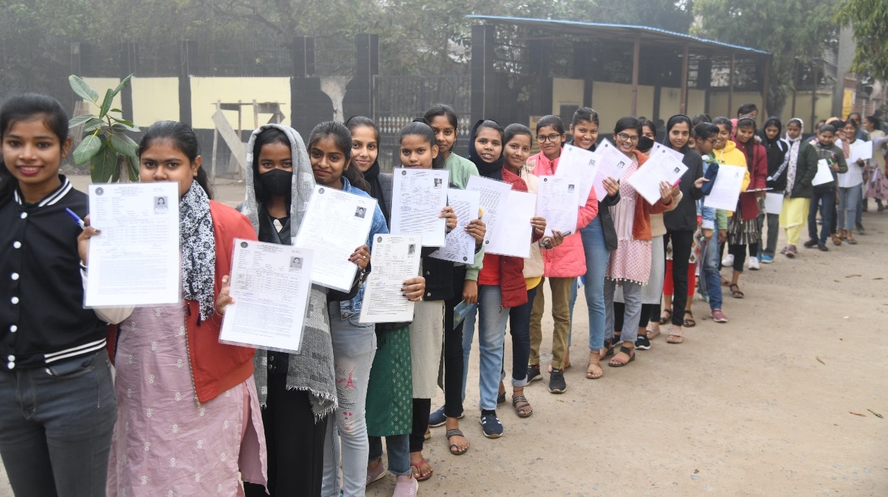 Students standing in queue to appear in the Bihar Board class 12th examination at D.D. Nandan Kanya High School Danapur in Patna 
Photo by Santosh Kumar