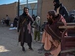 A Taliban security personnel stands gaurd during the food distribution as an aid to Afghan people at Nawabad Kako Sahib area in Baraki Barak district on January 7. A Taliban security personnel stands gaurd during the food distribution as an aid to Afghan people at Nawabad Kako Sahib area in Baraki Barak district on January 7.