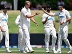 New Zealand Kyle Jamieson, centre, is congratulated by teammate Tim Southee, right