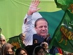 Supporters listen former prime minister Nawaz Sharif of the Pakistan Muslim Legue Nawaz (PMLN) speak during a rally on the last day of the election campaign in Kasur of Punjab province,