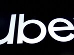 FILE PHOTO: A screen displays the company logo for Uber Technologies Inc. on the day of it's IPO at the New York Stock Exchange (NYSE) in New York, US.