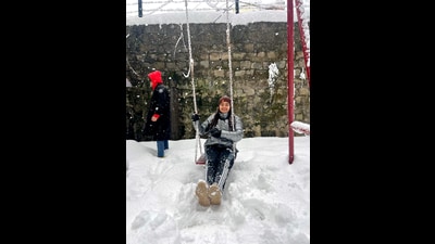 A tourist enjoys during snow at Patnitop in Udhampur. (ANI) A tourist enjoys during snow at Patnitop in Udhampur. (ANI)