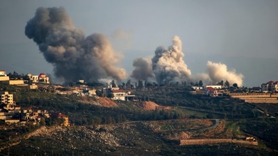 Smoke billows over the southern Lebanese border village of El-Khiam during Israeli bombardment on February 7, 2024, amid cross-border tensions with Lebanon, as fighting continues between Israel and the Palestinian militant group Hamas in Gaza. (Photo by Rabih DAHER / AFP) (AFP)