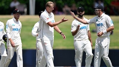 New Zealand Kyle Jamieson, centre, is congratulated by teammate Tim Southee, right (AP)