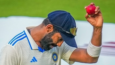 India's bowler Jasprit Bumrah, who took 6 wickets, shows the ball at the end of the first innings of England (PTI) India's bowler Jasprit Bumrah, who took 6 wickets, shows the ball at the end of the first innings of England (PTI)